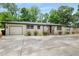Charming one-story home with painted brick, attached garage, and well-maintained front yard landscaping at 3154 N Druid Hills Rd, Decatur, GA 30033