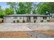 Inviting one-story home with painted brick, new driveway, and fresh landscaping for a clean, modern look at 3154 N Druid Hills Rd, Decatur, GA 30033