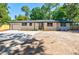 Single-story home with attached garage and large front parking pad at 3154 N Druid Hills Rd, Decatur, GA 30033