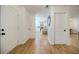 Hallway featuring hardwood floors, neutral paint, and access to the kitchen at 3154 N Druid Hills Rd, Decatur, GA 30033