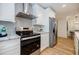 Close up of kitchen with stainless steel appliances and plenty of cabinet space at 3154 N Druid Hills Rd, Decatur, GA 30033