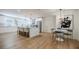 A large island anchors this kitchen with white cabinets, marble countertops, stainless appliances, and hardwood floors at 3154 N Druid Hills Rd, Decatur, GA 30033