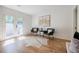 Bright seating area featuring hardwood floors, modern chairs, and stylish art on white walls at 3154 N Druid Hills Rd, Decatur, GA 30033