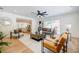 Bright living room with stylish furnishings, hardwood floors, and open view to the kitchen at 3154 N Druid Hills Rd, Decatur, GA 30033