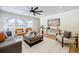 Bright living room featuring stylish furniture, hardwood floors, and a modern ceiling fan at 3154 N Druid Hills Rd, Decatur, GA 30033