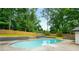 Backyard pool with lush landscaping provides a private oasis for relaxing and entertaining at 3154 N Druid Hills Rd, Decatur, GA 30033