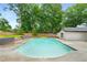 Backyard pool with lush landscaping provides a private oasis for relaxing and entertaining at 3154 N Druid Hills Rd, Decatur, GA 30033