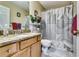 Full bathroom with a vanity, granite counter, and shower-tub combo at 3710 Burling Rdg, Lithonia, GA 30038