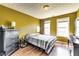 Cozy bedroom with a bed, dresser, and wood flooring at 3710 Burling Rdg, Lithonia, GA 30038
