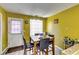 Cozy breakfast nook with a small table and chairs, next to the kitchen at 3710 Burling Rdg, Lithonia, GA 30038