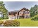 Charming two-story brick home with a well-manicured lawn and a two-car garage at 3710 Burling Rdg, Lithonia, GA 30038