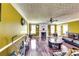 Inviting living room with hardwood floors, fireplace, and bright lighting from windows at 3710 Burling Rdg, Lithonia, GA 30038