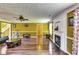 Spacious living room with hardwood floors, fireplace, and plenty of natural light from windows at 3710 Burling Rdg, Lithonia, GA 30038
