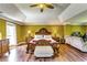 Vaulted ceiling enhances this main bedroom complete with hardwood floors, ceiling fan, and lots of space at 3710 Burling Rdg, Lithonia, GA 30038