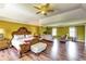 Expansive main bedroom featuring hardwood floors, a sitting area, and ample natural light at 3710 Burling Rdg, Lithonia, GA 30038