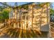 Expansive backyard view of the home featuring a spacious deck and a well-maintained lawn, perfect for outdoor activities at 4061 Preserve Trl, Snellville, GA 30039