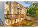 Back of home featuring a wood deck overlooking the private, treed backyard, and a walkout basement at 4061 Preserve Trl, Snellville, GA 30039