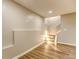 Basement area featuring stylish flooring, neutral walls, and a staircase leading to another level at 4061 Preserve Trl, Snellville, GA 30039