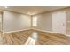 Bright basement area featuring stylish flooring, neutral walls, and a walkout door at 4061 Preserve Trl, Snellville, GA 30039