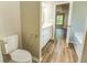 Bathroom view showcasing a toilet, vanity, and bathtub at 4061 Preserve Trl, Snellville, GA 30039