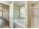 Bathroom view showcasing a tub and shower at 4061 Preserve Trl, Snellville, GA 30039