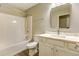 Bathroom with a shower and tub combination, modern vanity with a white marble countertop at 4061 Preserve Trl, Snellville, GA 30039