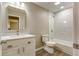 Well-lit bathroom featuring modern fixtures, a tub-shower combo, and a sleek vanity at 4061 Preserve Trl, Snellville, GA 30039