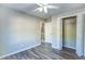 Bedroom featuring wood-look flooring, neutral paint, closet, and ceiling fan at 4061 Preserve Trl, Snellville, GA 30039