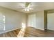 This bedroom has neutral paint, wood-look floors, and a double closet at 4061 Preserve Trl, Snellville, GA 30039
