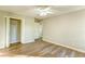 Bedroom features neutral paint, wood-look floors, closet, and entry doorway at 4061 Preserve Trl, Snellville, GA 30039