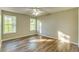 Bedroom featuring hardwood floors, neutral walls, and large windows for natural light at 4061 Preserve Trl, Snellville, GA 30039