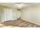 Bedroom with neutral paint, wood-look floors, double closet and entry doorway at 4061 Preserve Trl, Snellville, GA 30039