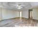 Spacious primary bedroom with trey ceiling, ceiling fan, and wood-look floors at 4061 Preserve Trl, Snellville, GA 30039