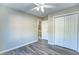 Bedroom featuring wood-look flooring, neutral paint, ceiling fan, and closet at 4061 Preserve Trl, Snellville, GA 30039
