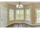 Breakfast nook area featuring large windows for natural light and door to outdoor deck at 4061 Preserve Trl, Snellville, GA 30039