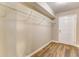 Walk-in closet featuring a built-in rack with room for storage and a view into an adjacent room at 4061 Preserve Trl, Snellville, GA 30039