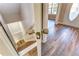 Inviting entryway with beautiful wood-look flooring, leading to a bright and airy interior at 4061 Preserve Trl, Snellville, GA 30039