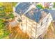 Aerial view of the backyard, featuring a well-maintained lawn and wooden deck at 4061 Preserve Trl, Snellville, GA 30039