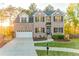Charming brick two-story home featuring a manicured lawn and an attached two-car garage at 4061 Preserve Trl, Snellville, GA 30039