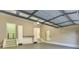 Garage featuring epoxy flooring, built-in storage cabinets and counter space, with interior access doors at 4061 Preserve Trl, Snellville, GA 30039