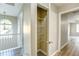 Hallway with a storage closet and decorative light fixture at 4061 Preserve Trl, Snellville, GA 30039