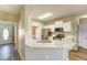 Modern kitchen featuring white countertops, stainless steel appliances, and stylish backsplash at 4061 Preserve Trl, Snellville, GA 30039