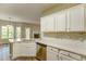 Modern kitchen featuring stainless steel appliances, stone countertops, and white cabinetry at 4061 Preserve Trl, Snellville, GA 30039