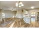 Open-concept living room connected to a kitchen featuring a breakfast bar at 4061 Preserve Trl, Snellville, GA 30039
