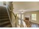 Open-concept living room featuring a fireplace, large windows, and hardwood floors at 4061 Preserve Trl, Snellville, GA 30039