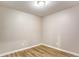 Small empty room with faux-wood floors at 4061 Preserve Trl, Snellville, GA 30039