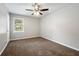 Comfortable bedroom with neutral carpet and a ceiling fan at 1152 Bailing Dr, Lawrenceville, GA 30043