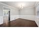 Bright dining room with hardwood floors and elegant wainscoting at 1152 Bailing Dr, Lawrenceville, GA 30043