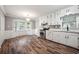 Bright kitchen with white cabinets, stainless steel appliances, and bay window at 1152 Bailing Dr, Lawrenceville, GA 30043