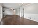 Open-concept living room with hardwood floors and a stone fireplace at 1152 Bailing Dr, Lawrenceville, GA 30043